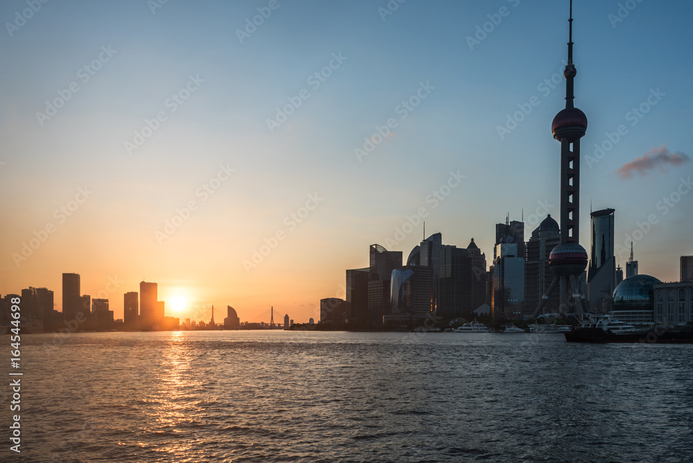 Shanghai skyline,landmarks of Shanghai with Huangpu river at sunrise/sunset in China.