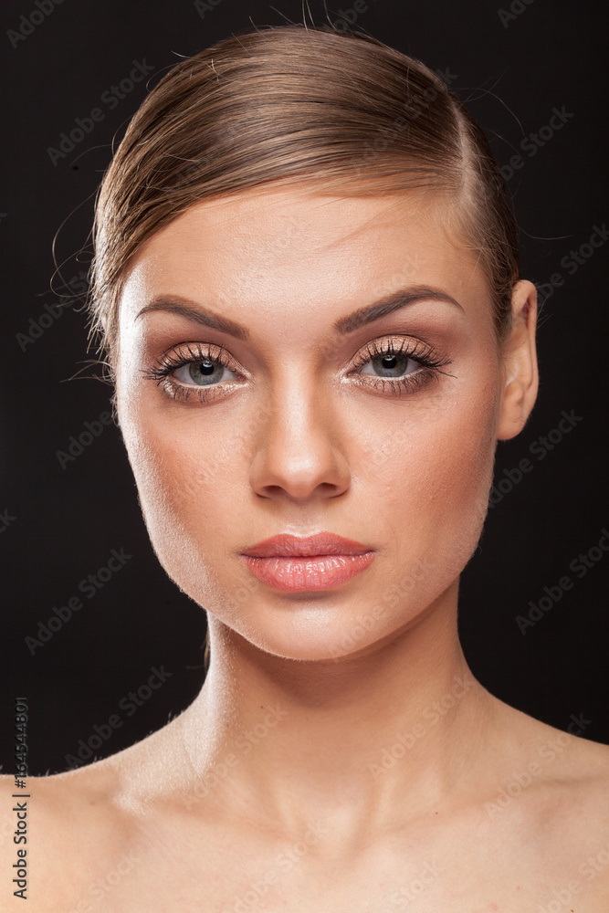 Portrait of beautiful woman with natural make up on black background Portrait of beautiful woman with natural make up on black background