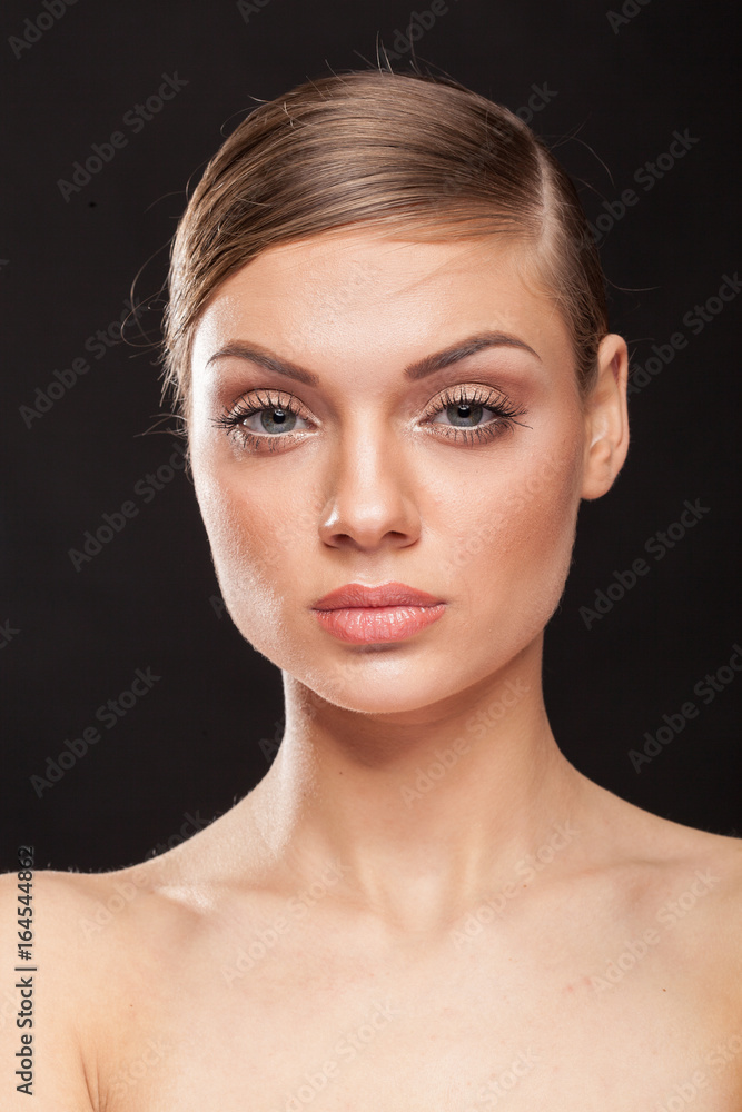 Portrait of beautiful woman with natural make up on black background Portrait of beautiful woman with natural make up on black background