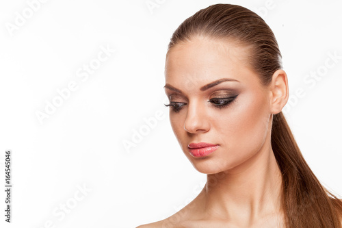 Blonde model with professional make up on white background