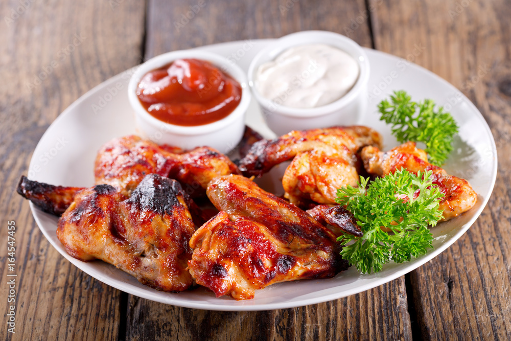 plate of grilled chicken wings plate of grilled chicken wings