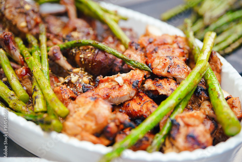 Fried green asparagus with chicken thighs, Dining concept of nutrition. Buffet. Food. photo