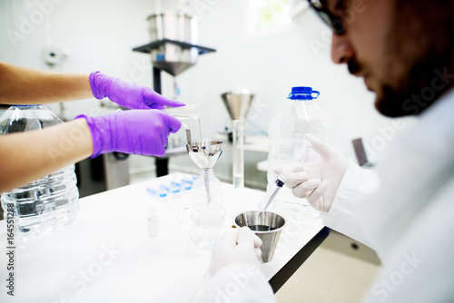 Group of scientist working at the laboratory.