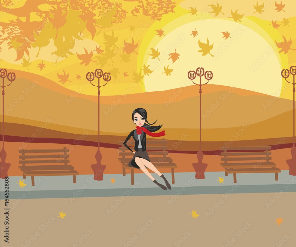girl sitting on the bench in the autumn day