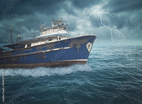 Boat on the stormy Ocean photo