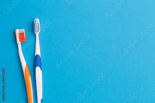 Two toothbrushes , space for text