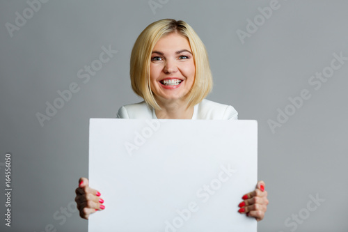 Young woman with blank sheet