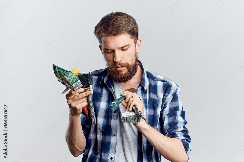 Young guy on white isolated background, repair, tools Young guy on white isolated background, repair, tools