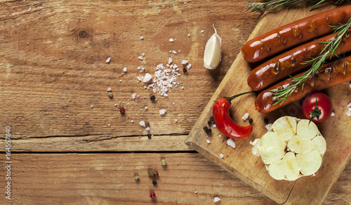 Foto Wiener Sausages on wooden background. Top view.