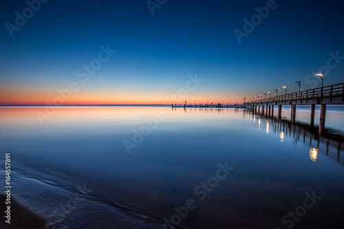 Amazing sunrise on the pier at the seaside. Gdynia Orlowo  Poland