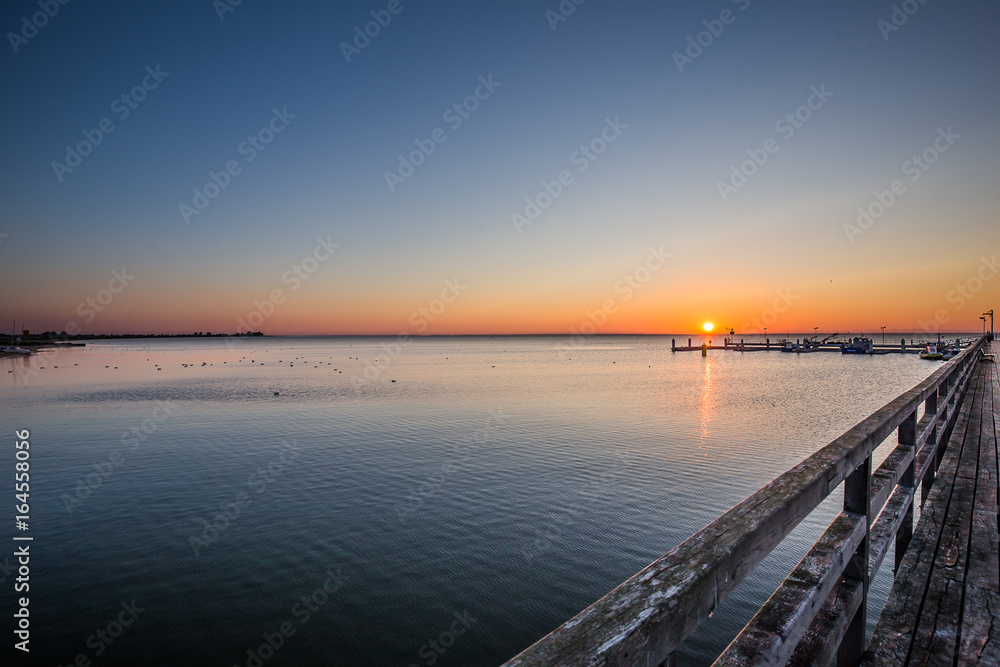 Amazing sunrise on the pier at the seaside. Gdynia Orlowo, Poland
Amazing sunrise on the pier at the seaside. Gdynia Orlowo, Poland