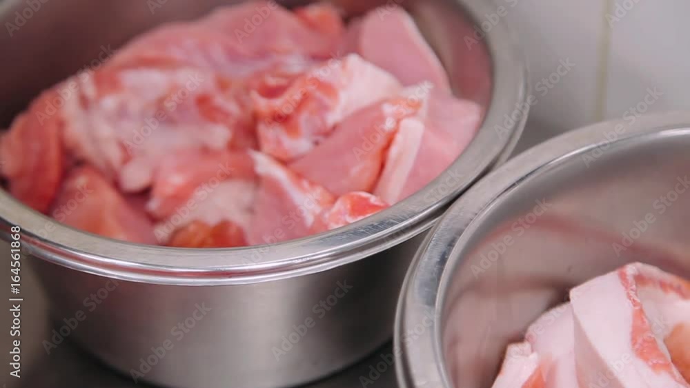 Kitchen, view of the ingredients for cooking into a pan, meat, pork.
Kitchen, view of the ingredients for cooking into a pan, meat, pork.