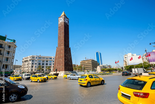 Obraz na płótnie Cityscape with clock tower monument on central square in Tunis city. Tunisia, North Africa w salonie