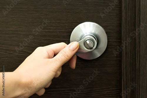 Hand open door knob or opening the door