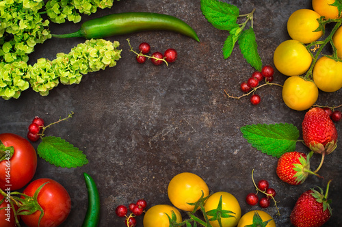 Set organic food. Fresh raw vegetables for salad. On a old black background. Top view. Close-up