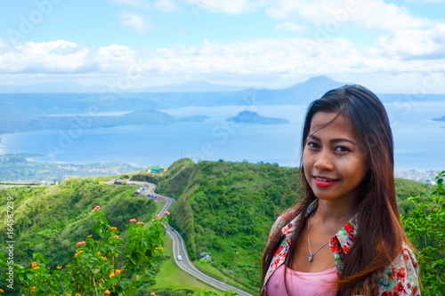 Natural portrait Beautiful Asian girl smiling. Asian woman on top of the mountain peak. summer hiking