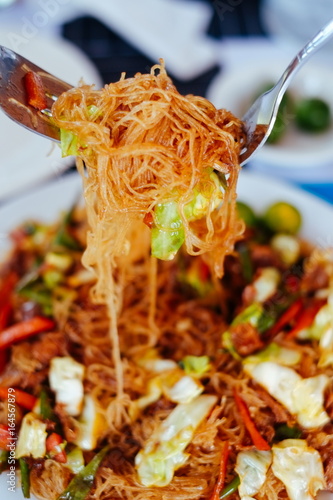 Tasty stir fry rice noodle with meat and vegetables, Asian food celebration