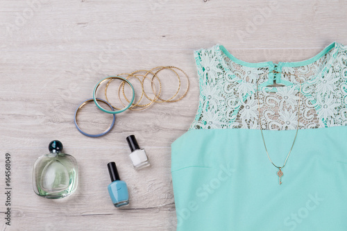 Turquoise dress and stylish accessories.