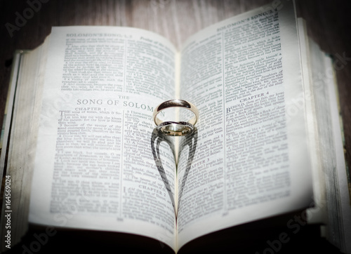 Wedding rings heart shadow in the bible