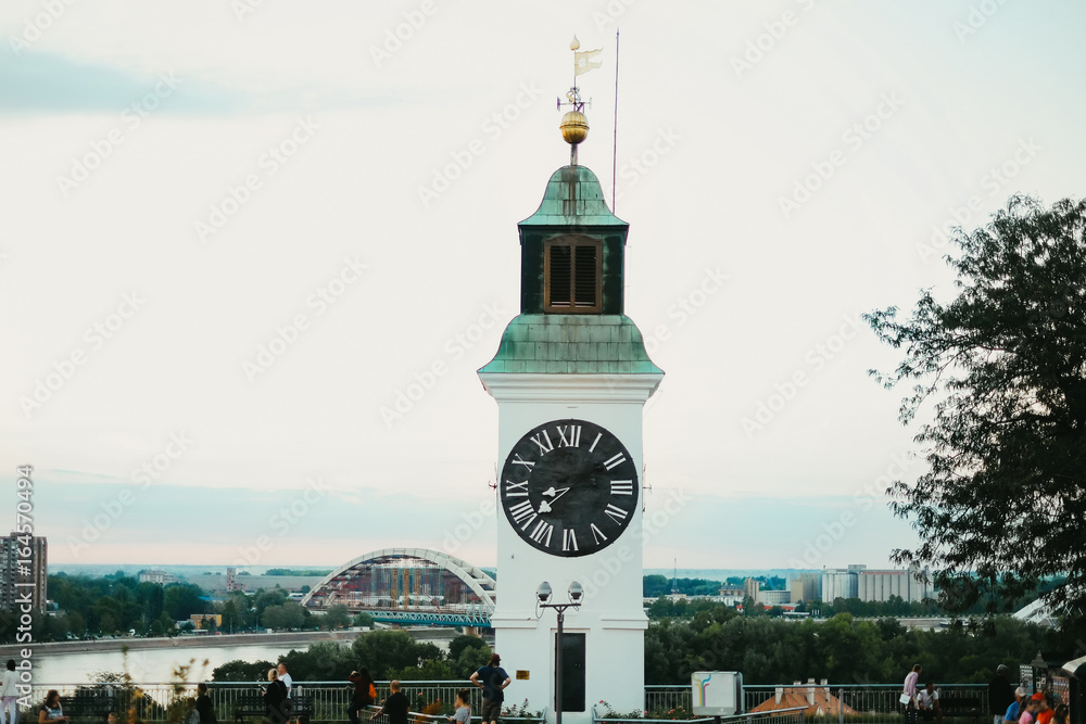 Old clock tower with inverted minutes and hours pointers on