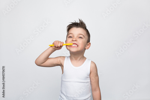 Little boy brushing teeth