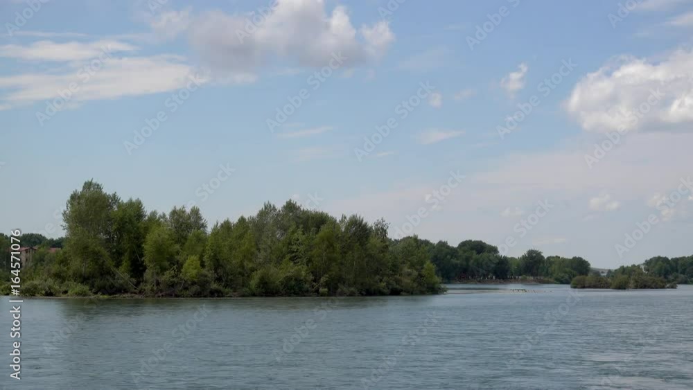 View of the Irtysh River, clouds in the blue sky and trees. The Irtysh River is a river in Russia, China, and Kazakhstan. 4k prores video View of the Irtysh River, clouds in the blue sky and trees. The Irtysh River is a river in Russia, China, and Kazakhstan. 4k prores video