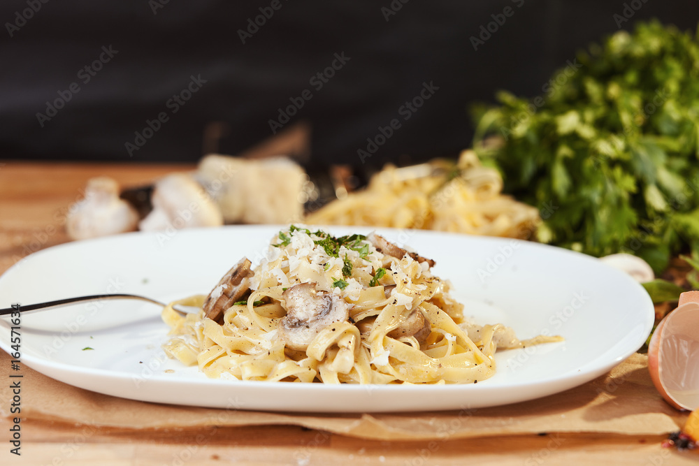 Pasta tagliatelle with mushrooms and parmesan. 
