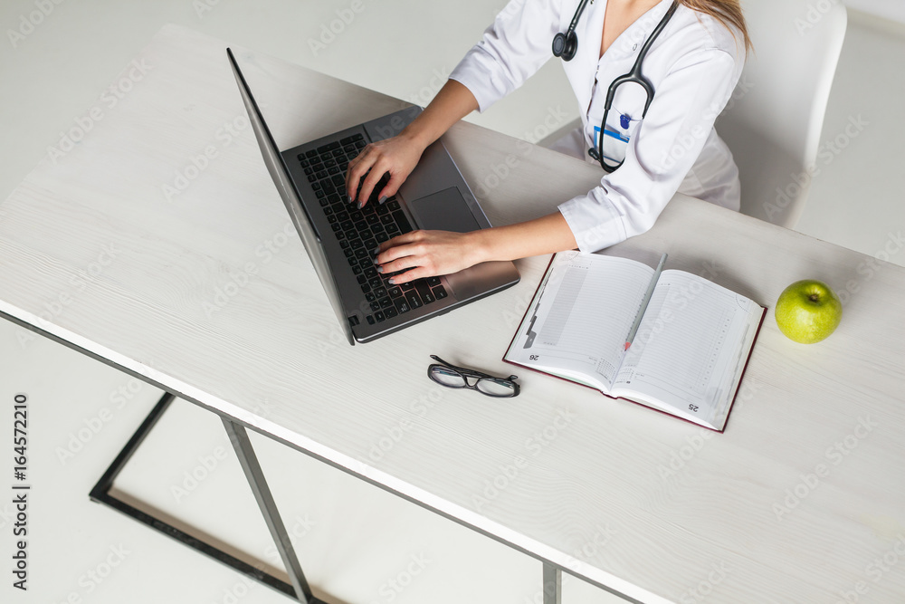 Fototapeta premium Crop doctor at desktop