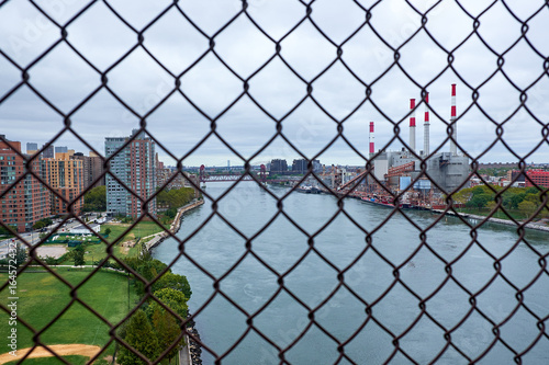 NEW YORK CITY - SEPTEMBER 29, 2016: Ravenswood Generating Station in Long Island City, at the bank of East River, Roosevelt Island to the left