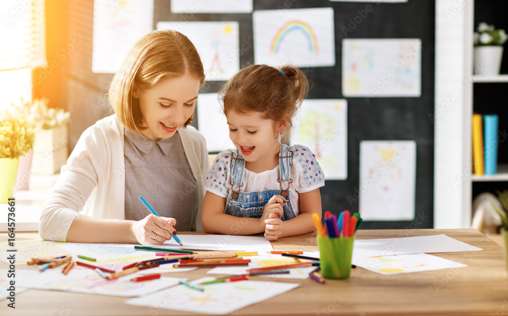 mother and child daughter draws in creativity in kindergarten mother and child daughter draws in creativity in kindergarten