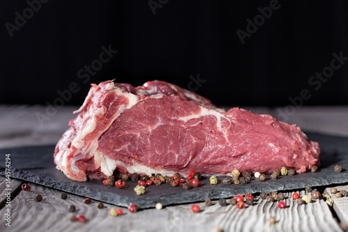 A piece of fresh steamed meat for steak on a table
