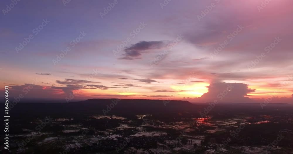 4K Aerial view ; Drone fly over the field with water reflect the color of the sunset sky. 4K Aerial view ; Drone fly over the field with water reflect the color of the sunset sky.