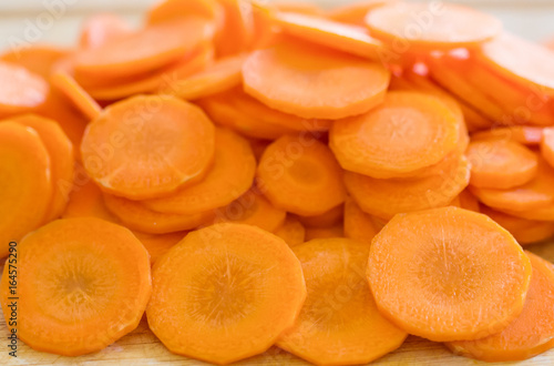 Fresh carrot, cut slices background, Carrot peeled.