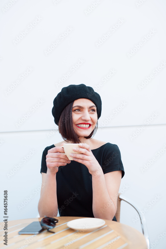 Cheerful woman enjoying coffee Cheerful woman enjoying coffee