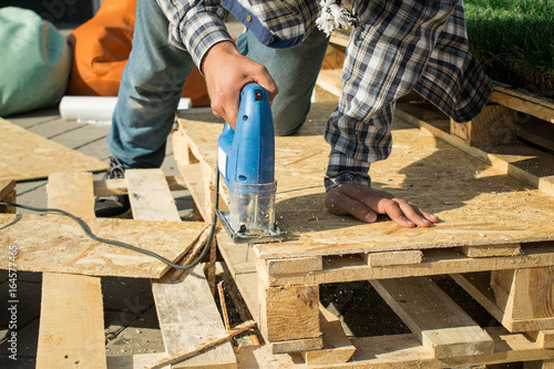 Repairs on the street. Tools for repair. Wood processing