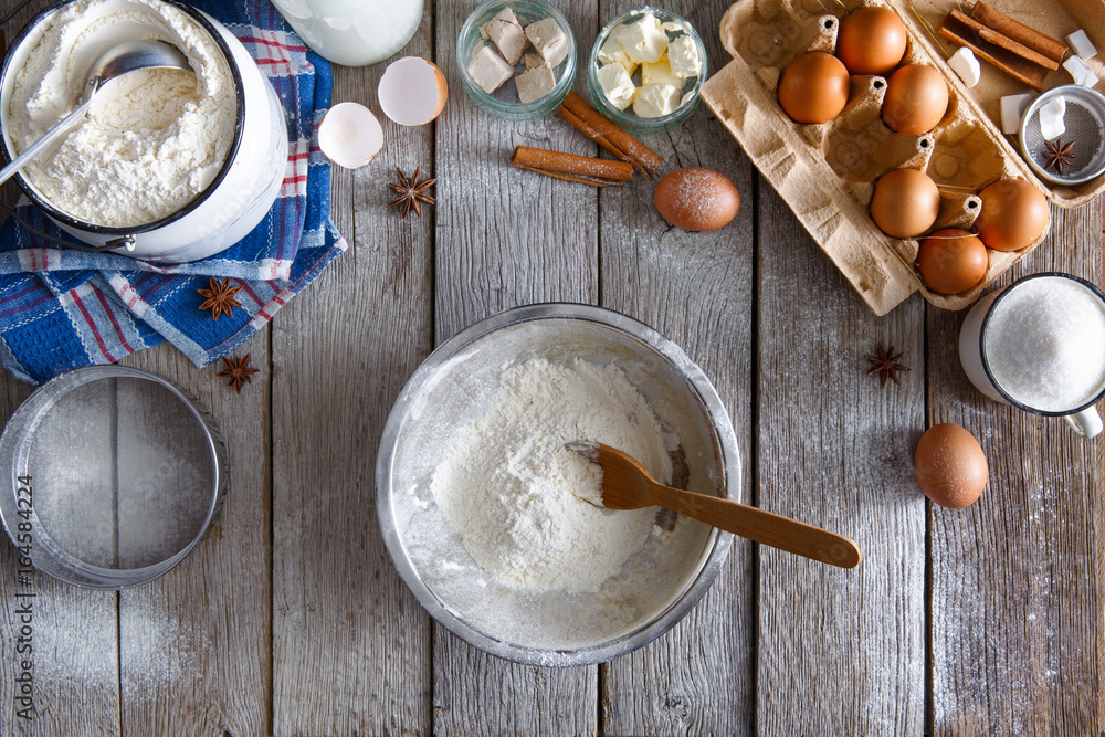 Baking ingredients on rustic wood background Baking ingredients on rustic wood background
