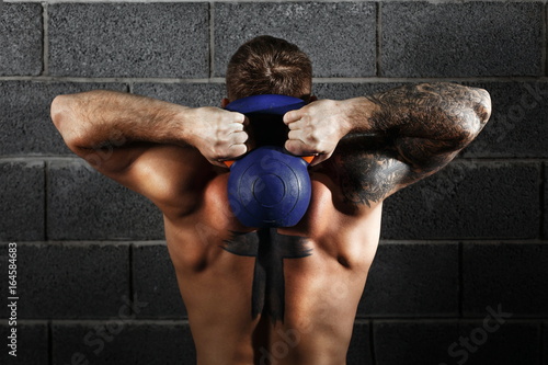Man workout with kettle bell