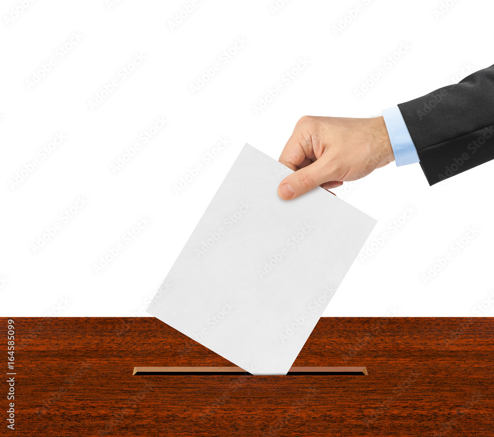 Hand with paper ballot Hand with paper ballot