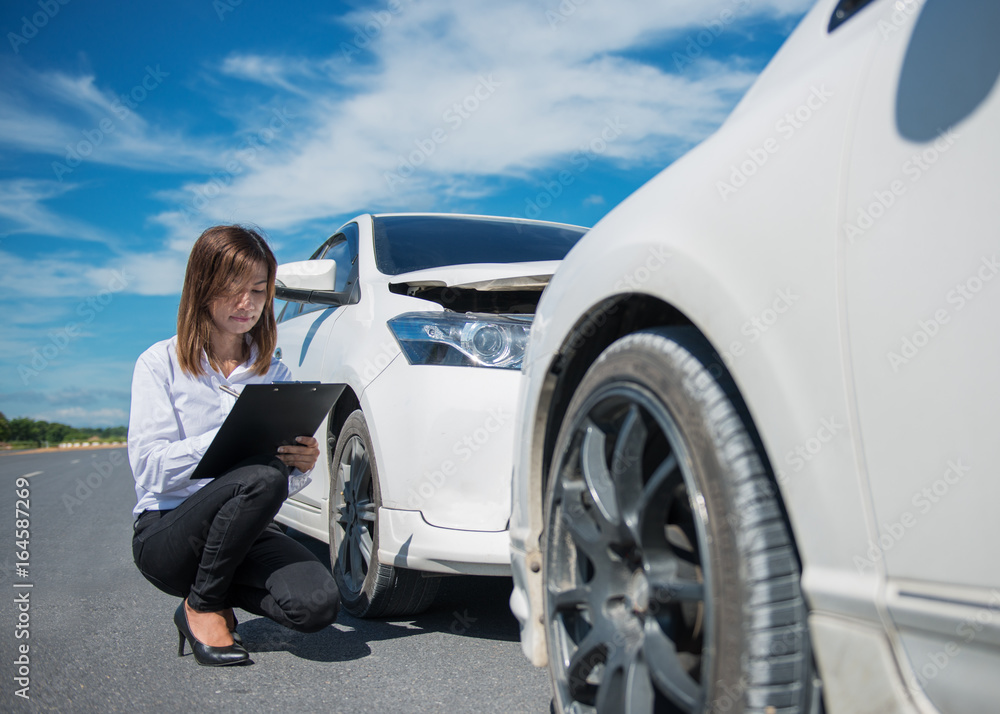 Car collision. Driver man and woman examining damaged automobile cars after crash accident in city Car collision. Driver man and woman examining damaged automobile cars after crash accident in city