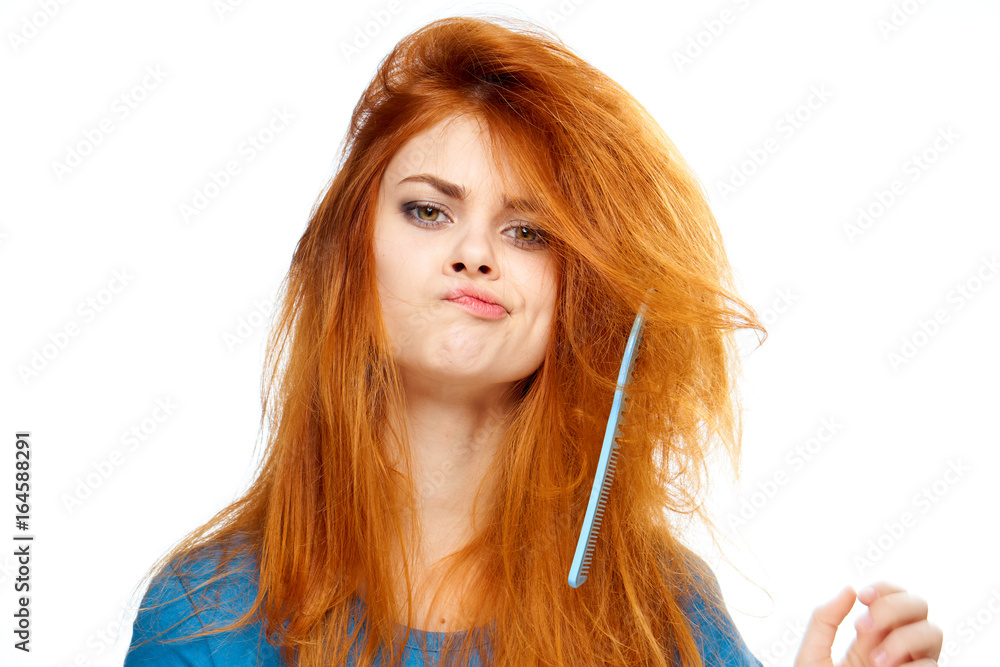 Young beautiful woman on white isolated background, hairstyle, hairbrush Young beautiful woman on white isolated background, hairstyle, hairbrush