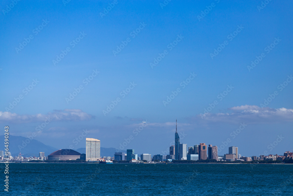 Fukuoka city scape and landmarks, Fukuoka tower and Fukuoka dome over ocean.
Fukuoka city scape and landmarks, Fukuoka tower and Fukuoka dome over ocean.