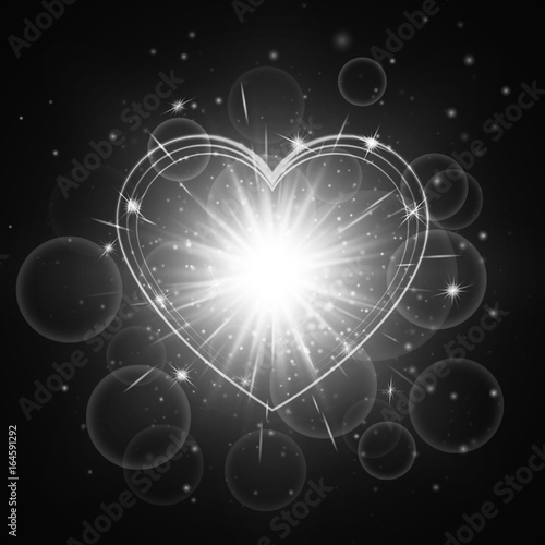 Luminous background with shining light. Romantic design with a bright glowing heart.   