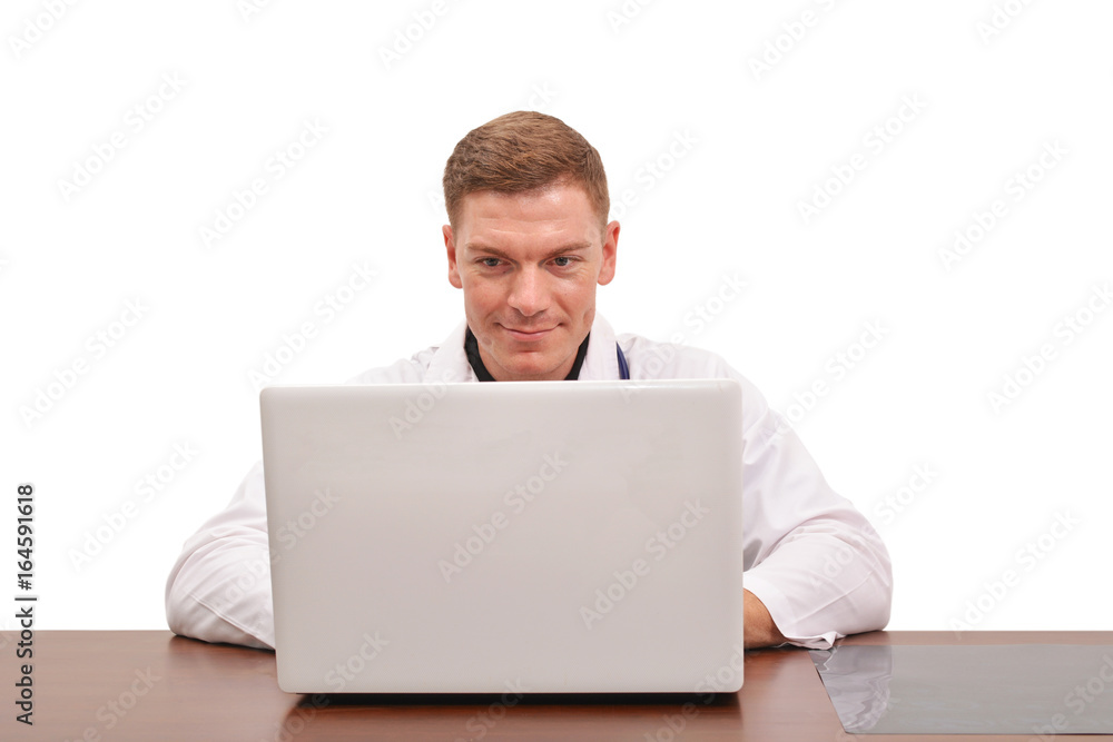 Portrait of young male doctor using computer on white background Portrait of young male doctor using computer on white background