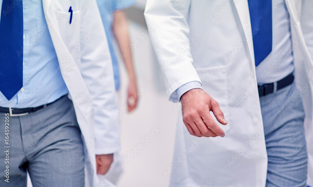 close up of medics or doctors walking in hospital close up of medics or doctors walking in hospital