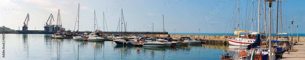 Yachts, sailing boats and pleasure boats are moored in marina of Balchik city in black sea coast at Bulgaria