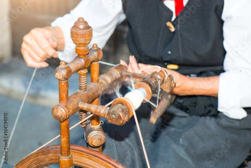 Woman with chassis to put wool photo