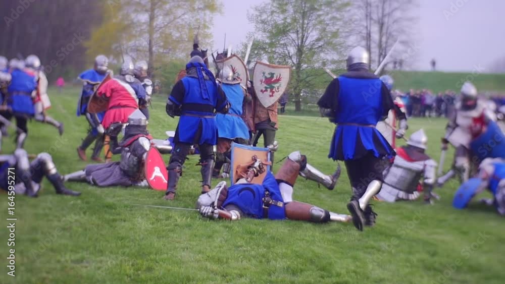 Heavily-Armed Soldiers Fight in a Wide Field Heavily-Armed Soldiers Fight in a Wide Field