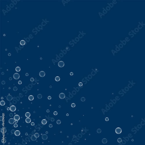 Soap bubbles. Scattered bottom left corner with soap bubbles on deep blue background. Vector illustration.