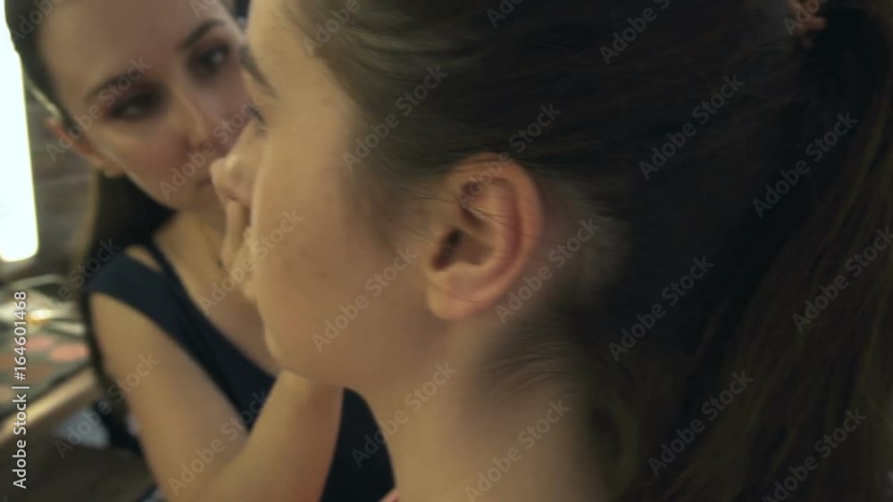 Professional make-up artist making face makeup art. Make up and fashion concept Professional make-up artist making face makeup art. Make up and fashion concept
