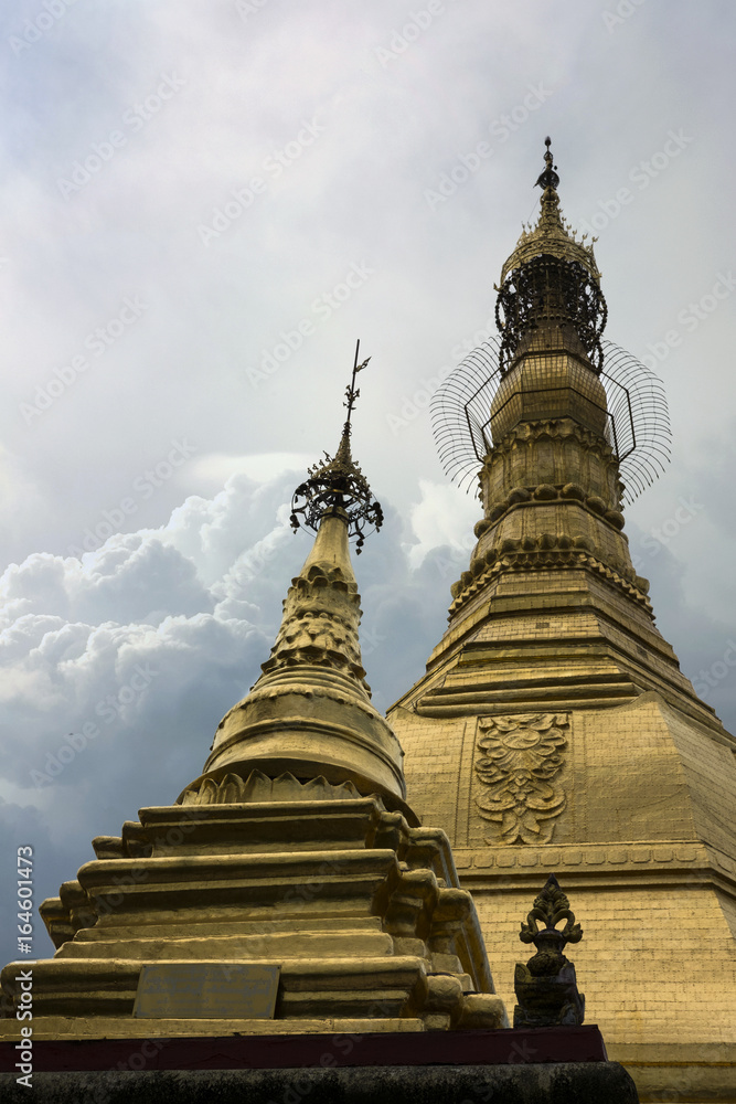 THE GLITTERING PAGODA
The sky scene of golden Pagoda in the center city of Yangon. The pagoda was built with gold.
